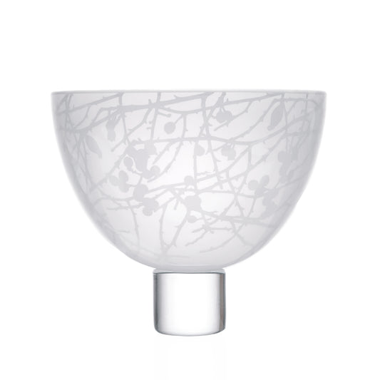 White decorative glass bowl with intricate dhedgerowesign on a white background