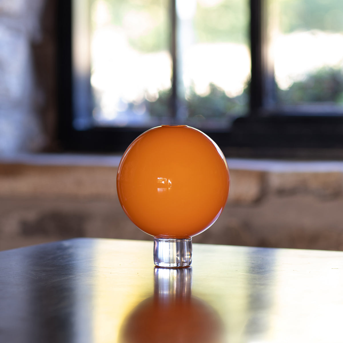 an opaque pumpkin orange glass posey vase, perfect for Halloween